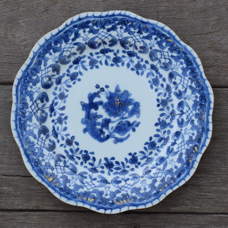 A antique chinese blue and white dish with molded rim period of Qianlong