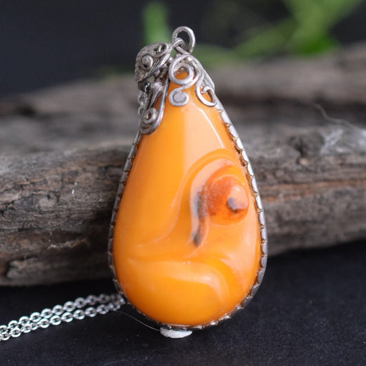 Antique natural baltic amber pendant egg yolk handcarved floral design 1960's